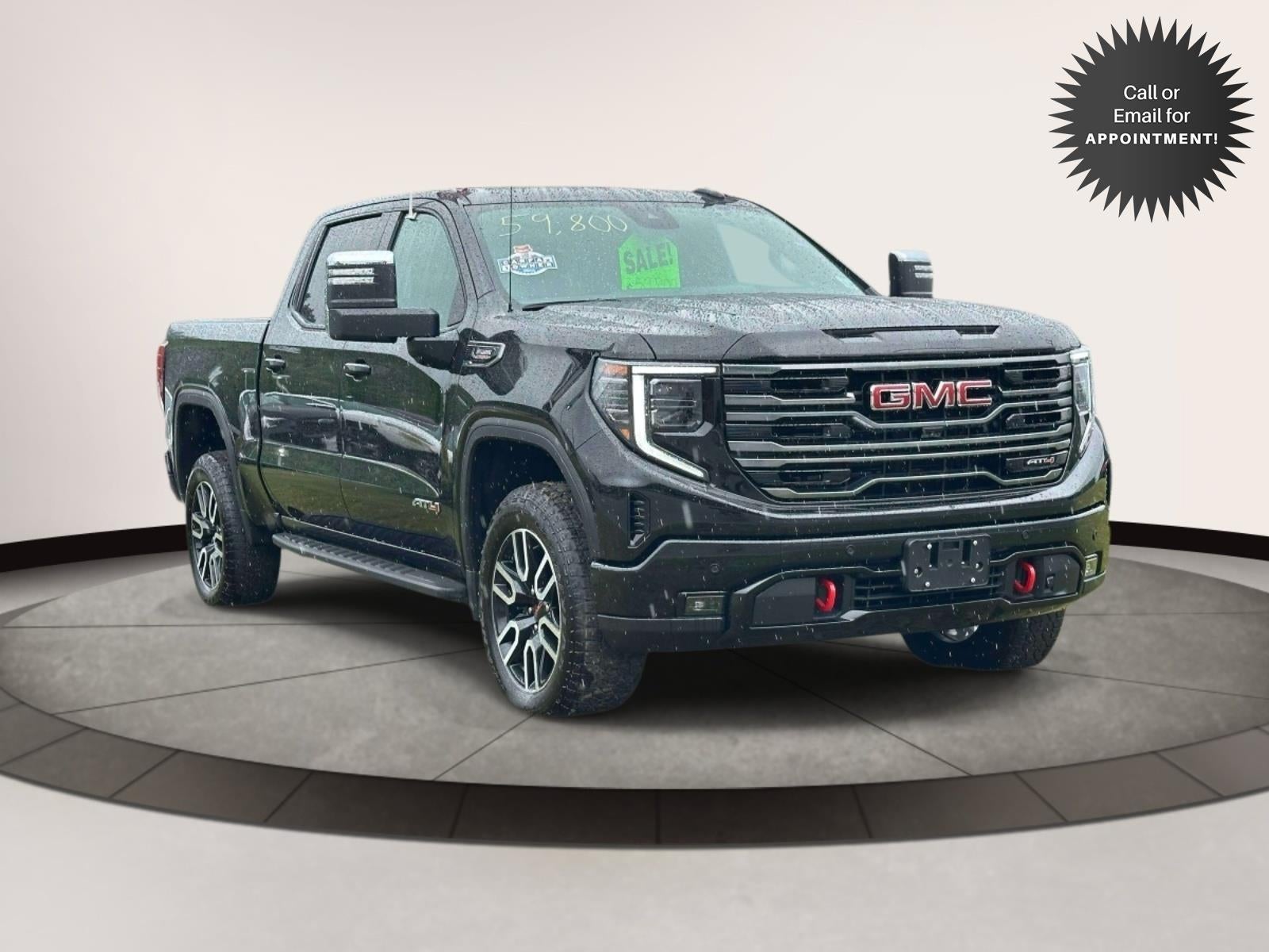 2025 GMC Sierra 1500 4WD Crew Cab 147 AT4 in Black — front three-quarter view