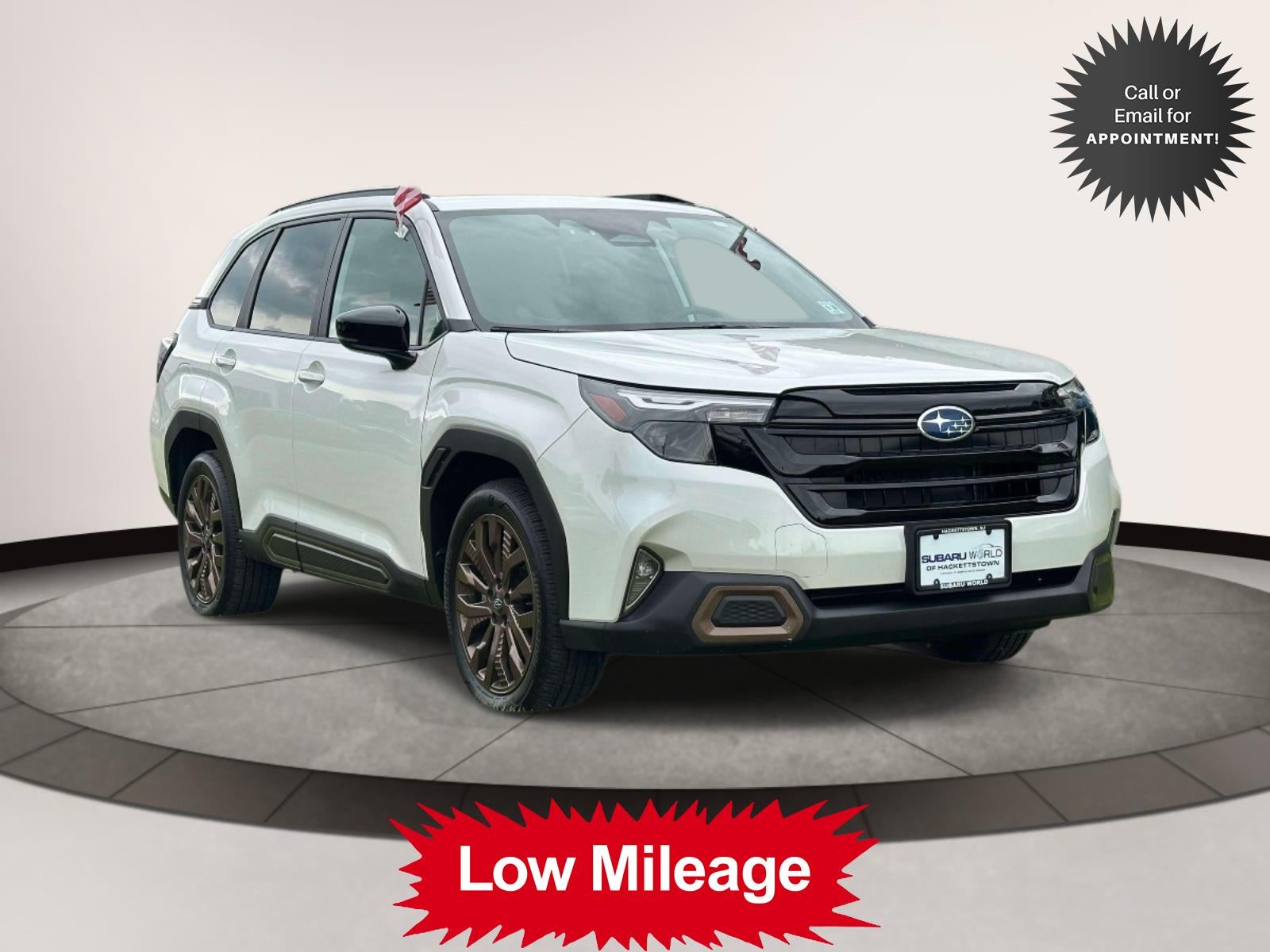 2025 Subaru Forester Sport AWD in White — front three-quarter view